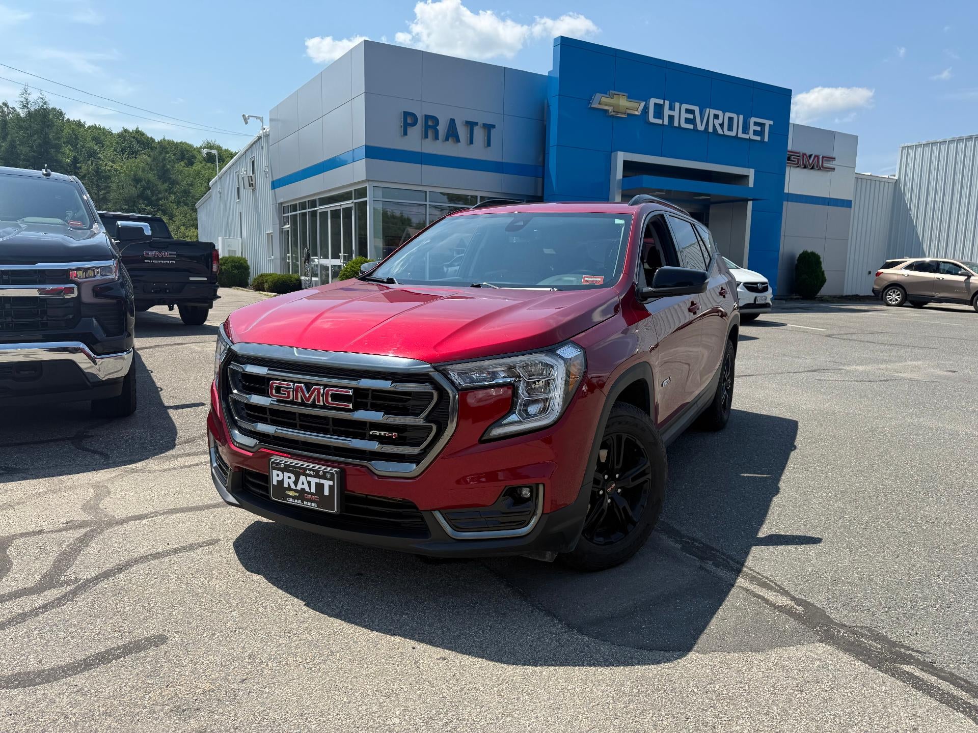 2024 GMC Terrain AWD AT4 in Volcanic Red Tintcoat — front three-quarter view